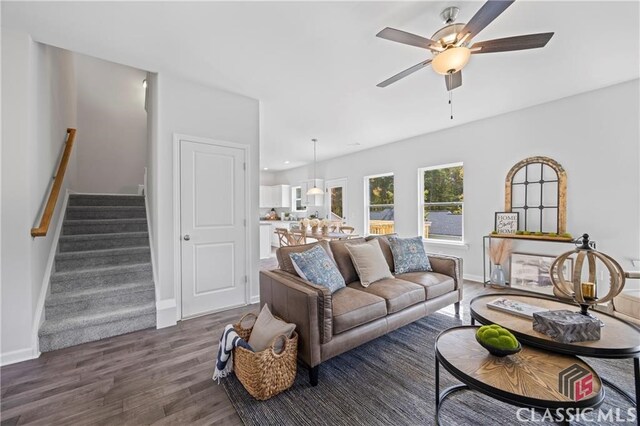 132 Water Oak Way, Crawford, GA 30630 - living area featuring a ceiling fan, wood finished floors, stairway, and baseboards
