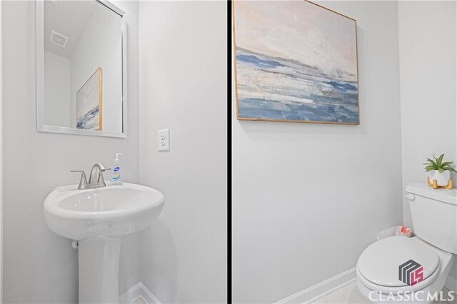 132 Water Oak Way, Crawford, GA 30630 - bathroom featuring toilet and baseboards