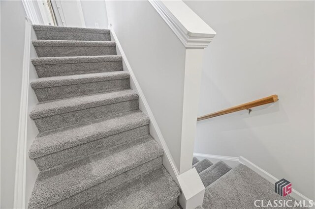 132 Water Oak Way, Crawford, GA 30630 - staircase featuring carpet floors and baseboards