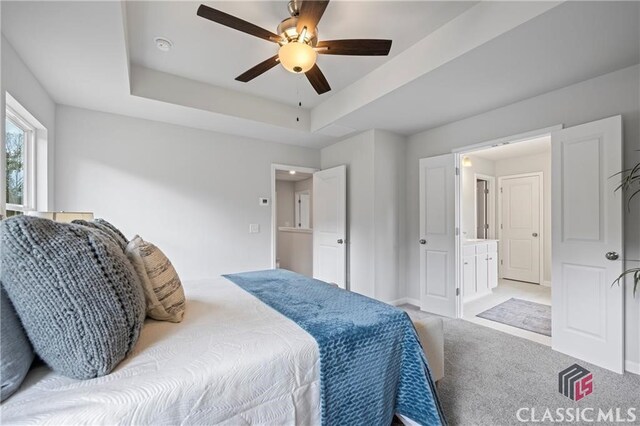132 Water Oak Way, Crawford, GA 30630 - bedroom with light colored carpet, a tray ceiling, a ceiling fan, and baseboards