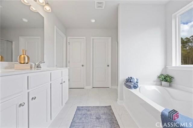 132 Water Oak Way, Crawford, GA 30630 - full bath with vanity, a bath, marble finish flooring, and recessed lighting