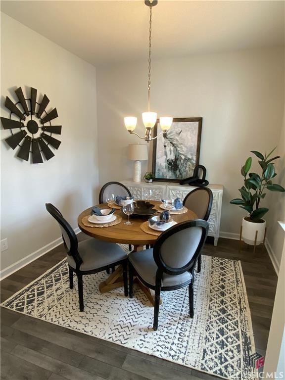 132 Water Oak Way, Crawford, GA 30630 - dining room with a chandelier, baseboards, and wood finished floors