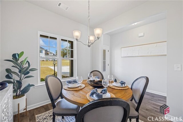 132 Water Oak Way, Crawford, GA 30630 - dining room with a chandelier, wood finished floors, and baseboards