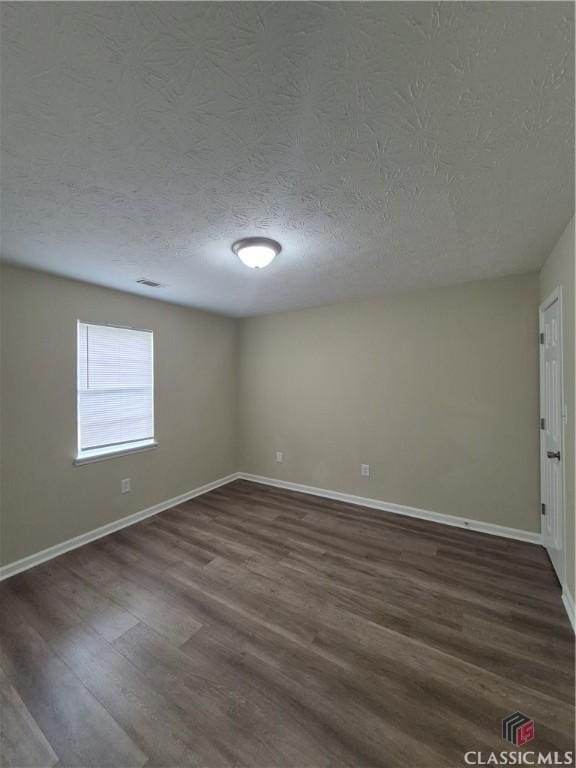 115 Big Oak Cir, Athens, GA 30605 - unfurnished room with a textured ceiling, dark wood-type flooring, and baseboards