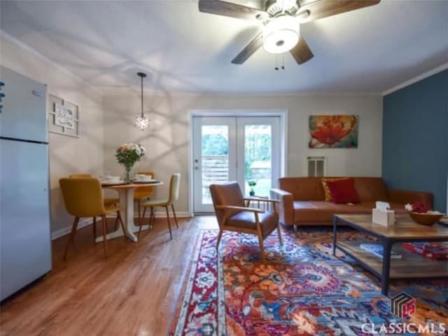 256 Cherokee Rdg, Athens, GA 30606 - living area featuring wood finished floors, a ceiling fan, crown molding, and baseboards