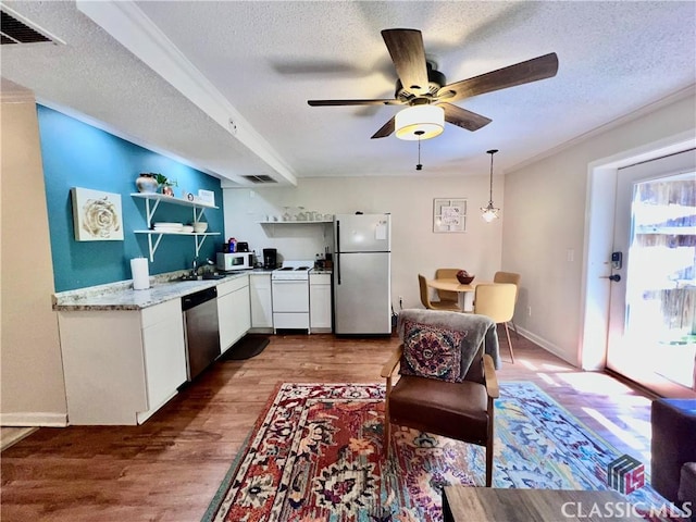 256 Cherokee Rdg, Athens, GA 30606 - kitchen with appliances with stainless steel finishes, a textured ceiling, white cabinets, wood finished floors, and open shelves