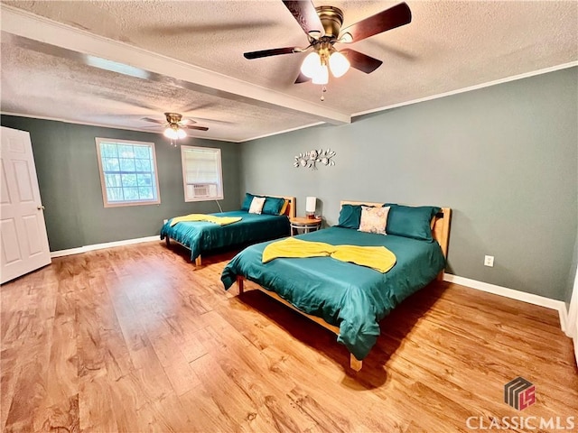 256 Cherokee Rdg, Athens, GA 30606 - bedroom featuring a textured ceiling, wood finished floors, baseboards, ceiling fan, and ornamental molding