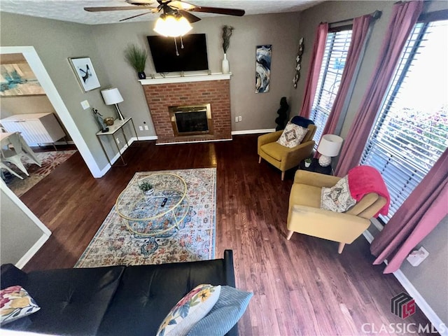 256 Cherokee Rdg, Athens, GA 30606 - living room with a ceiling fan, wood finished floors, baseboards, and a brick fireplace