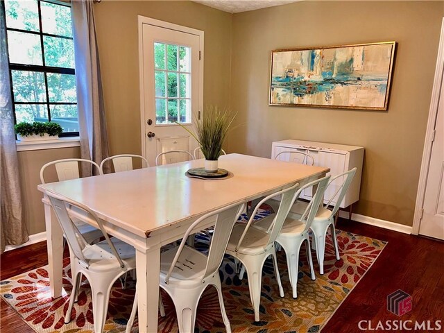 256 Cherokee Rdg, Athens, GA 30606 - dining room featuring dark wood-style flooring and baseboards
