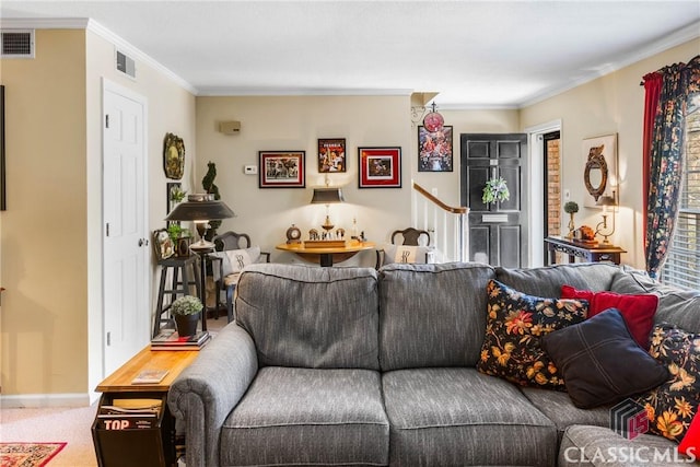 carpeted living room with ornamental molding, baseboards, and stairs