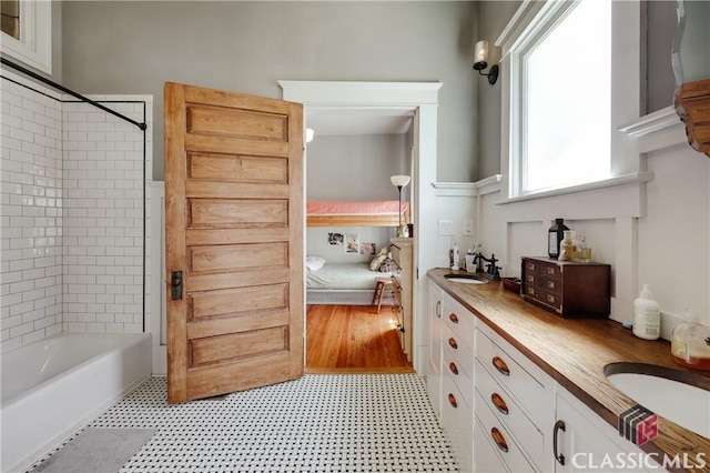 full bathroom with tile patterned floors, bathtub / shower combination, and vanity
