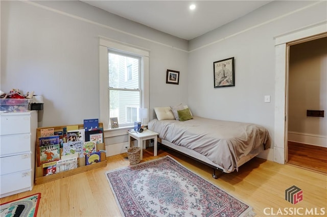 bedroom featuring wood finished floors