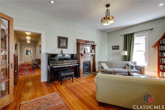 living area featuring wood finished floors and a fireplace
