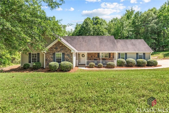 single story home featuring a porch, stone siding, and a front yard