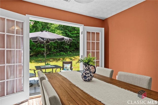 dining room featuring a textured ceiling