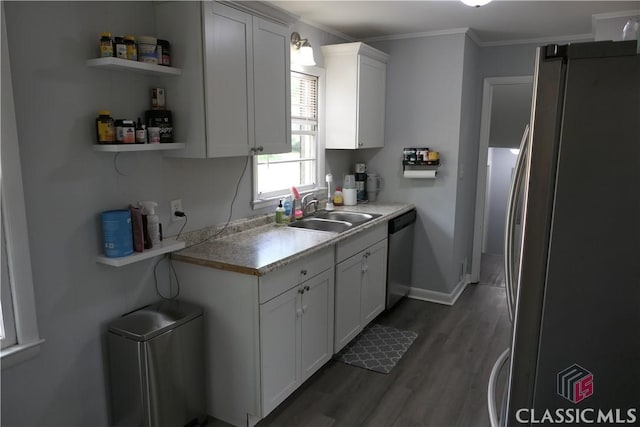 348 Jefferson River Rd, Athens, GA 30607 - kitchen with appliances with stainless steel finishes, a sink, dark wood-type flooring, ornamental molding, and white cabinets