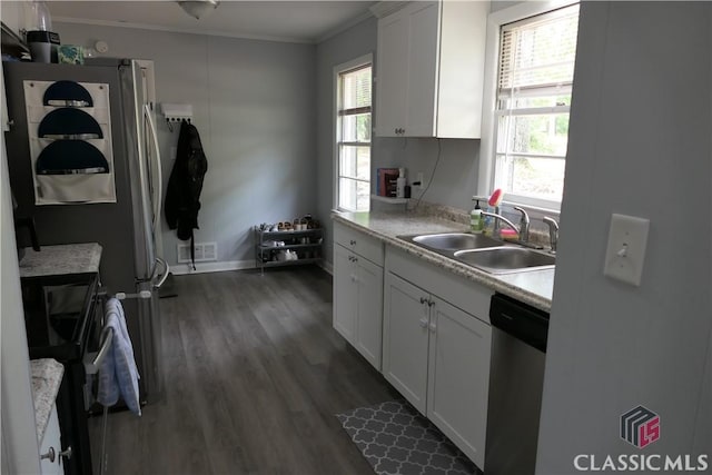 348 Jefferson River Rd, Athens, GA 30607 - kitchen featuring a sink, appliances with stainless steel finishes, ornamental molding, light countertops, and dark wood finished floors