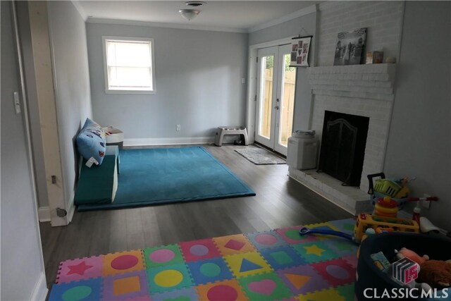 348 Jefferson River Rd, Athens, GA 30607 - living room with crown molding, wood finished floors, healthy amount of natural light, and baseboards