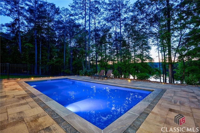 view of swimming pool featuring a patio area and a fenced backyard