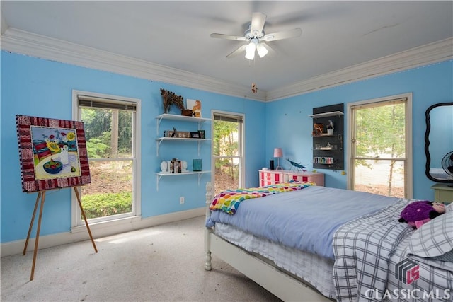 carpeted bedroom featuring crown molding, multiple windows, baseboards, and ceiling fan