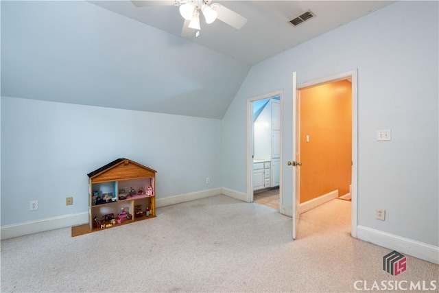 additional living space with ceiling fan, vaulted ceiling, baseboards, and carpet floors