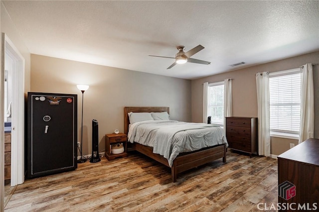 2100 New Hope Church Rd, Comer, GA 30629 - bedroom with light wood finished floors, ceiling fan, and baseboards