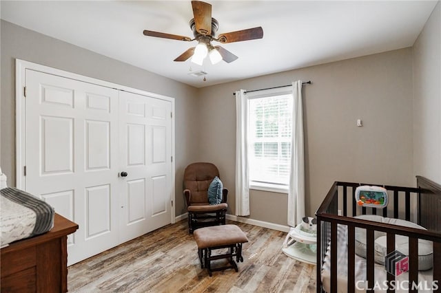 2100 New Hope Church Rd, Comer, GA 30629 - bedroom with light wood-style flooring, a closet, baseboards, and a ceiling fan