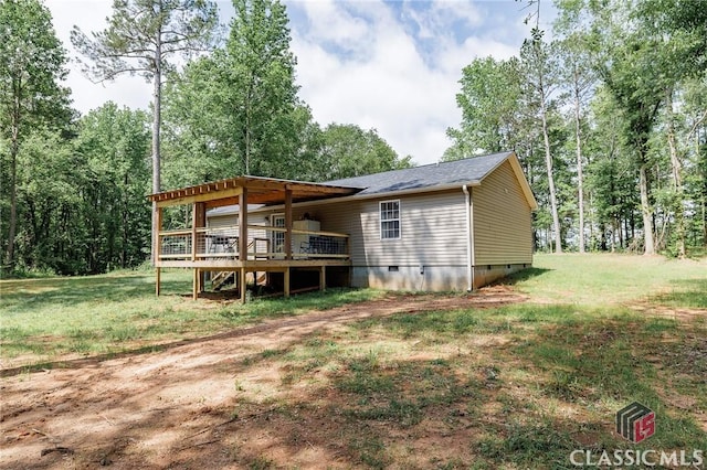 2100 New Hope Church Rd, Comer, GA 30629 - rear view of property with crawl space, a wooden deck, a lawn, and a shingled roof