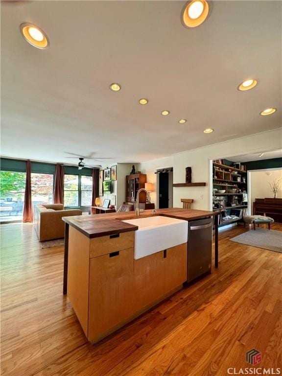160 Gran Ellen Dr, Athens, GA 30606 - kitchen featuring open floor plan, stainless steel dishwasher, a sink, wooden counters, and recessed lighting