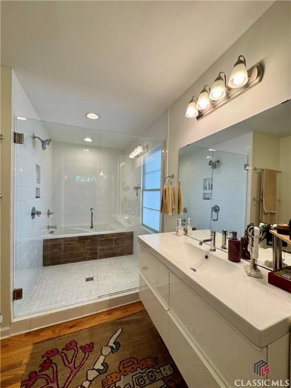 160 Gran Ellen Dr, Athens, GA 30606 - full bathroom with a shower stall, wood finished floors, and vanity
