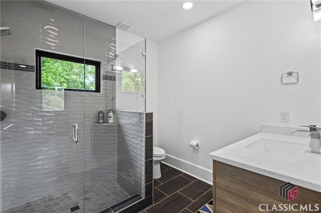 1895 Vintage Pl, Watkinsville, GA 30677 - bathroom with baseboards, toilet, a shower stall, vanity, and recessed lighting