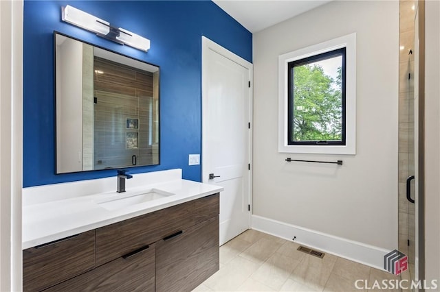 1895 Vintage Pl, Watkinsville, GA 30677 - bathroom with a shower stall, baseboards, and vanity