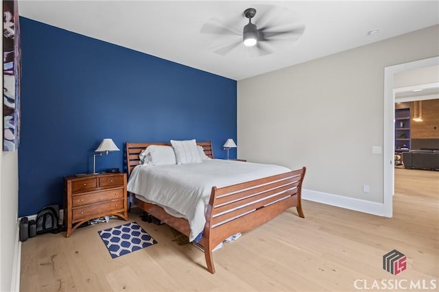 1895 Vintage Pl, Watkinsville, GA 30677 - bedroom featuring wood finished floors, baseboards, and a ceiling fan