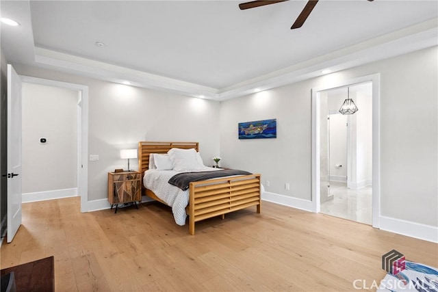 1895 Vintage Pl, Watkinsville, GA 30677 - bedroom with a tray ceiling, light wood-style flooring, recessed lighting, and baseboards
