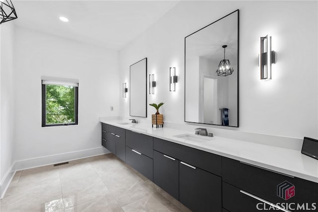 1895 Vintage Pl, Watkinsville, GA 30677 - full bathroom featuring baseboards, double vanity, a chandelier, tile patterned flooring, and recessed lighting