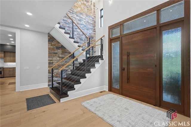 1895 Vintage Pl, Watkinsville, GA 30677 - foyer entrance featuring baseboards, stairs, wood finished floors, a towering ceiling, and recessed lighting