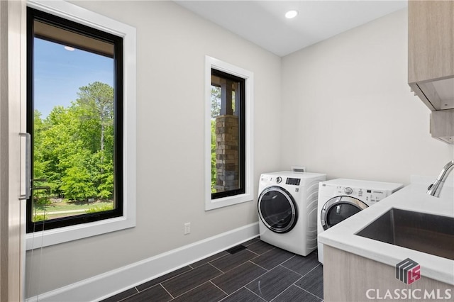 1895 Vintage Pl, Watkinsville, GA 30677 - clothes washing area with washing machine and clothes dryer, baseboards, cabinet space, and recessed lighting