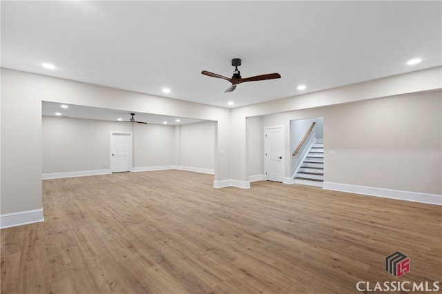 1895 Vintage Pl, Watkinsville, GA 30677 - finished basement featuring stairway, recessed lighting, light wood-style flooring, ceiling fan, and baseboards