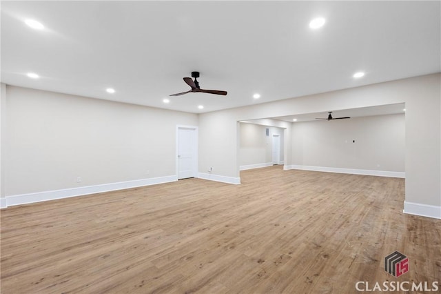 1895 Vintage Pl, Watkinsville, GA 30677 - unfurnished living room featuring ceiling fan, light wood-style flooring, baseboards, and recessed lighting