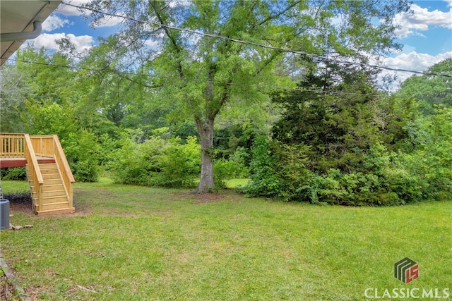 1119 John W Breedlove Rd, Monroe, GA 30656 - view of green lawn with stairs and a wooden deck