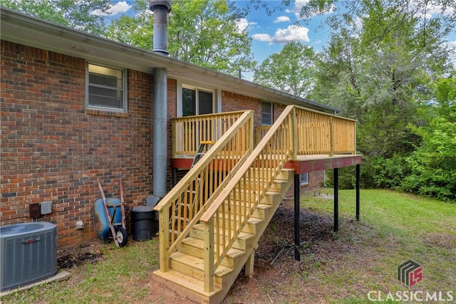 1119 John W Breedlove Rd, Monroe, GA 30656 - wooden deck with central air condition unit, stairs, and a yard