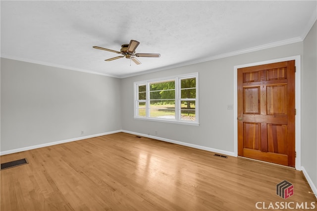 1119 John W Breedlove Rd, Monroe, GA 30656 - empty room featuring ceiling fan, light wood finished floors, baseboards, and crown molding