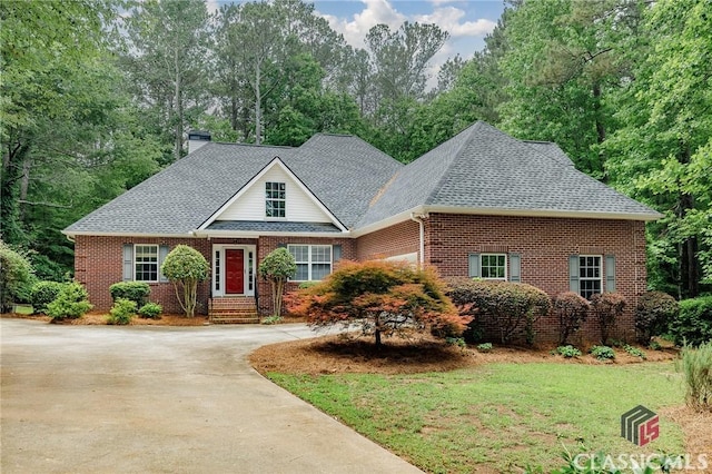 115 Crystal Creek Ct, Hull, GA 30646 - traditional-style home featuring brick siding, roof with shingles, a chimney, driveway, and a front lawn