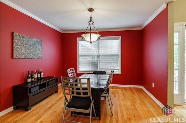 115 Crystal Creek Ct, Hull, GA 30646 - dining space with light wood finished floors, crown molding, and baseboards