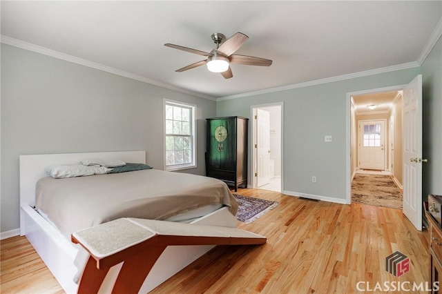 115 Crystal Creek Ct, Hull, GA 30646 - bedroom with light wood finished floors, ornamental molding, baseboards, a ceiling fan, and ensuite bath