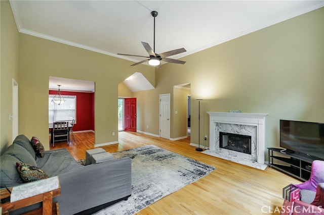 115 Crystal Creek Ct, Hull, GA 30646 - living area with ornamental molding, wood finished floors, a fireplace, a ceiling fan, and baseboards