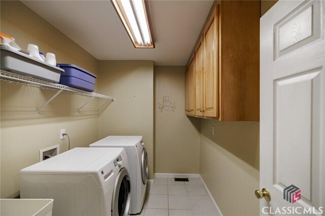 115 Crystal Creek Ct, Hull, GA 30646 - laundry room with separate washer and dryer, light tile patterned floors, cabinet space, and baseboards