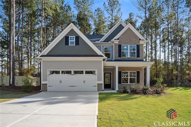 174 Water Oak Way, Crawford, GA 30630 - craftsman-style house featuring brick siding, concrete driveway, a front yard, and an attached garage