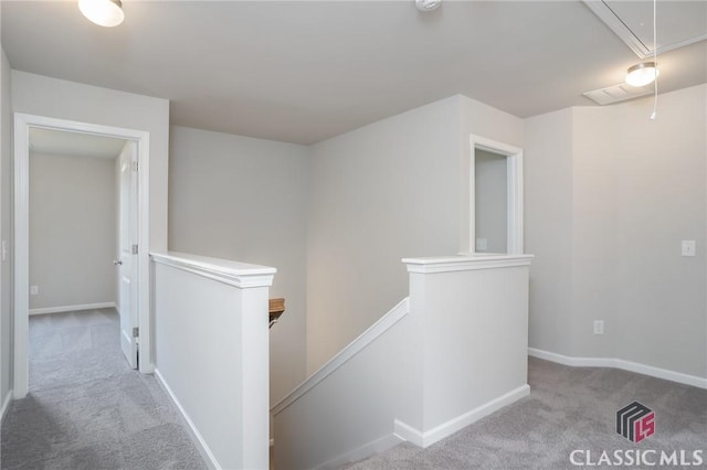 174 Water Oak Way, Crawford, GA 30630 - hallway with an upstairs landing, carpet flooring, attic access, and baseboards