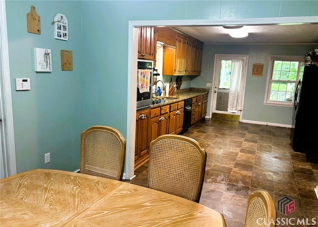 75 Gunnell Rd, Comer, GA 30629 - kitchen with brown cabinetry, black appliances, baseboards, and a sink